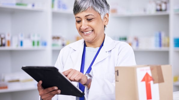 Female scientist on tablet 