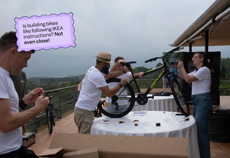 Four Scilife team members putting together a bike | Scilife