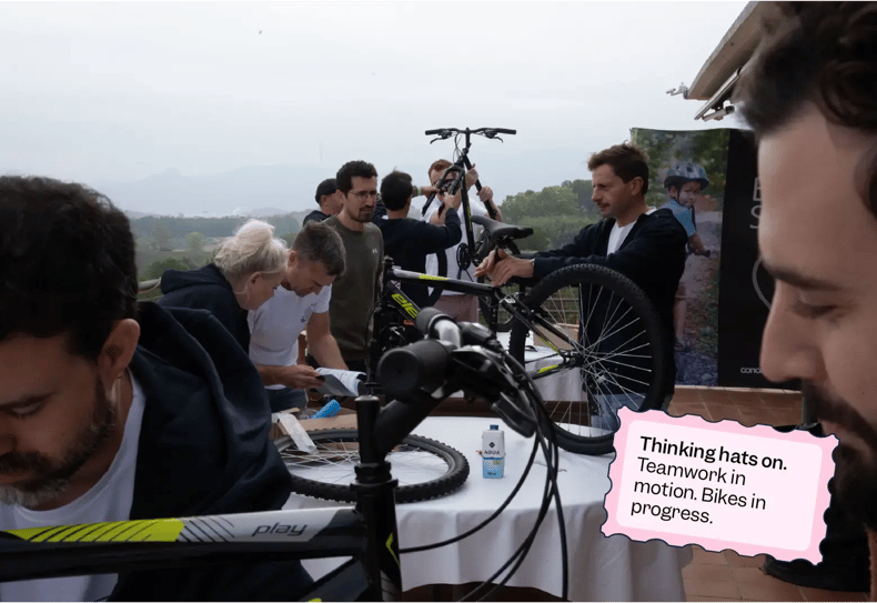 A group of Scilife employees working groups to build bikes | Scilife