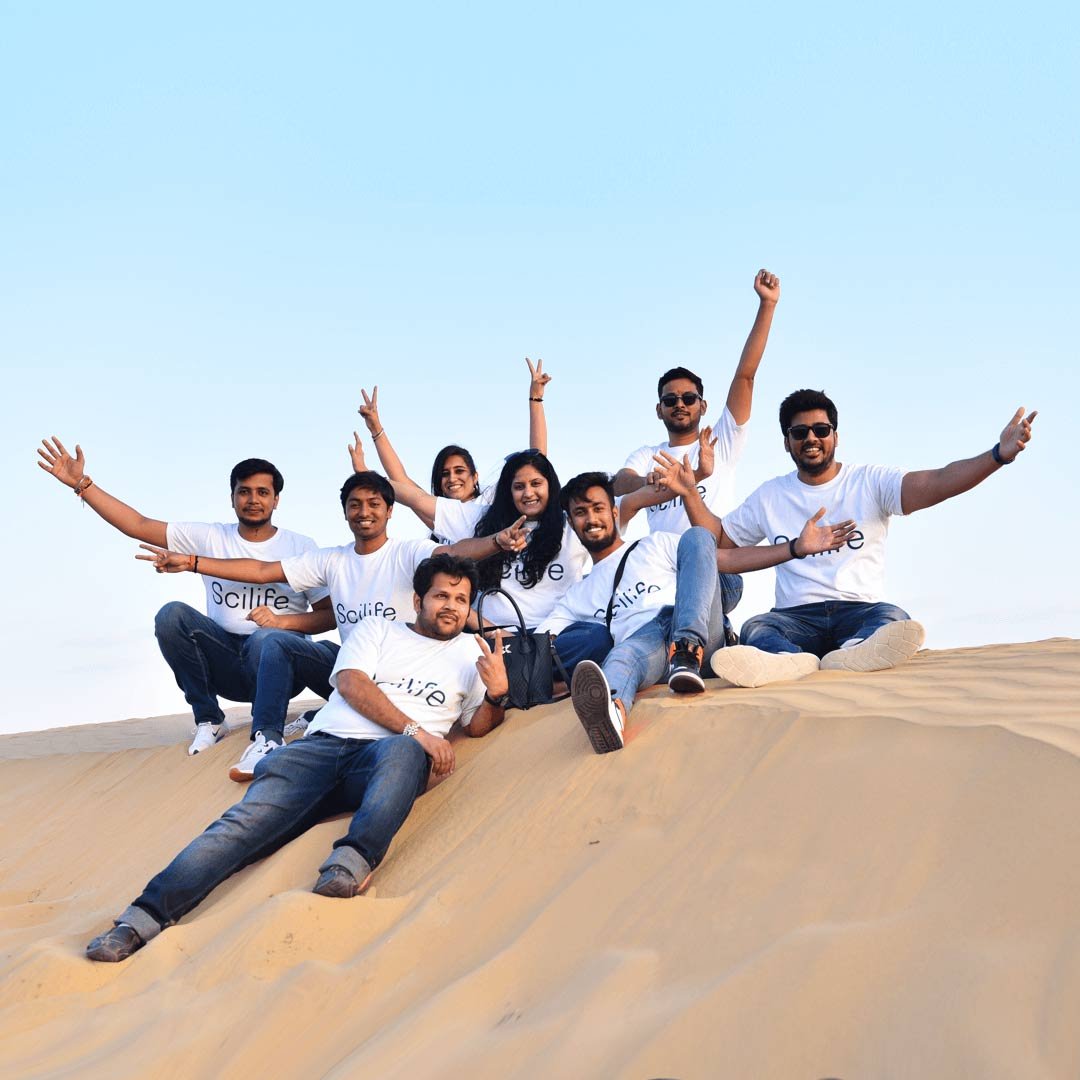 Team picture on sand dunes in India | Scilife