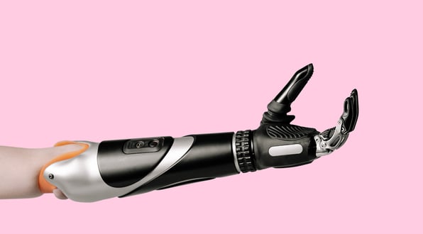 Picture of an innovative arm and hand prothesis in pink background