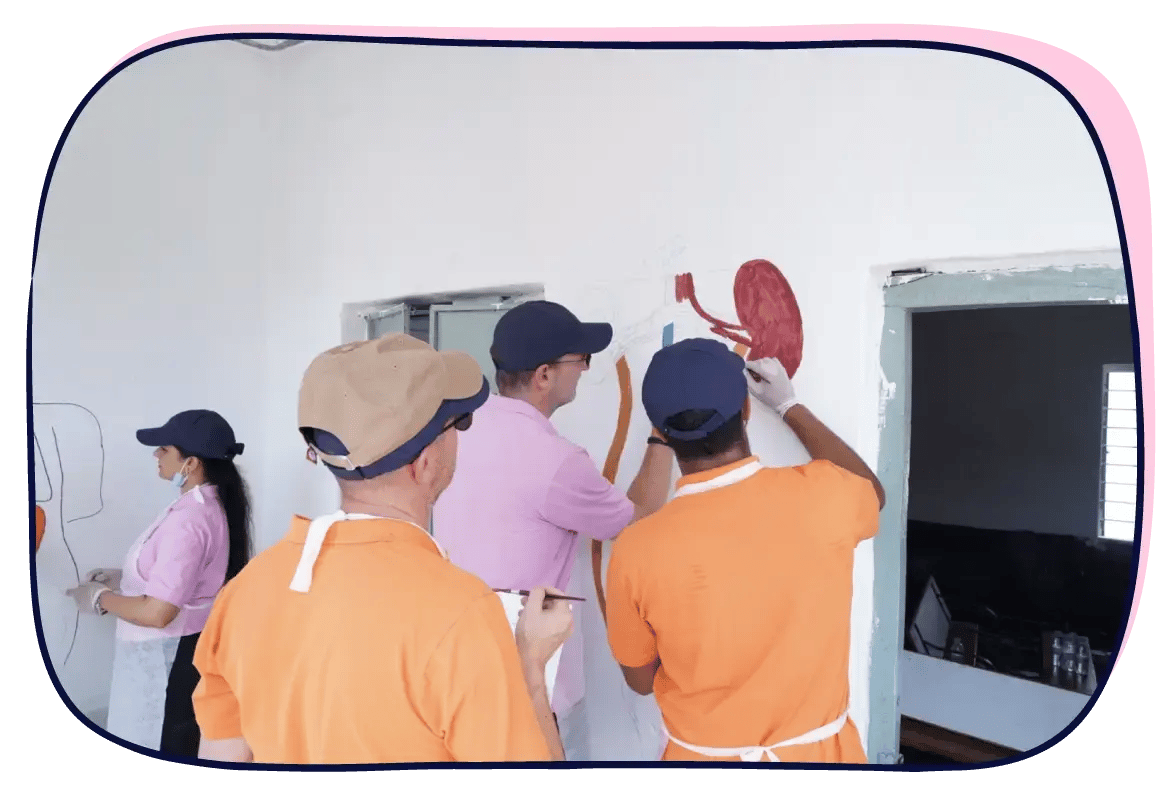 Colorful school murals come to life as Scilife volunteers paint walls with care, creativity, and community spirit | Scilife