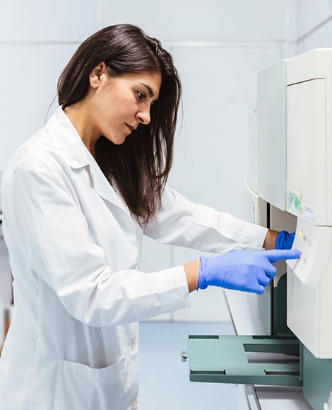 QA professional working with lab equipment