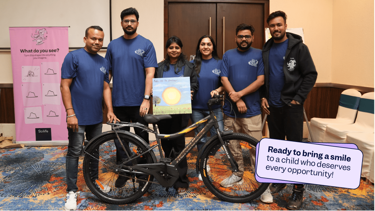 Scilifers with a built bike and colourful canvas for charity | Scilife