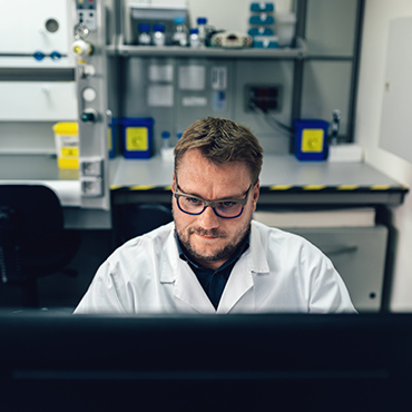 Picture of a man working with a computer in a laboratory 