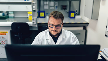 It specialist working on a lab computer